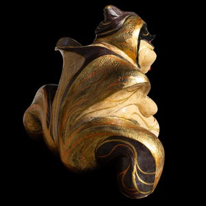 Golden ceramic sculpture of sumo wrestler